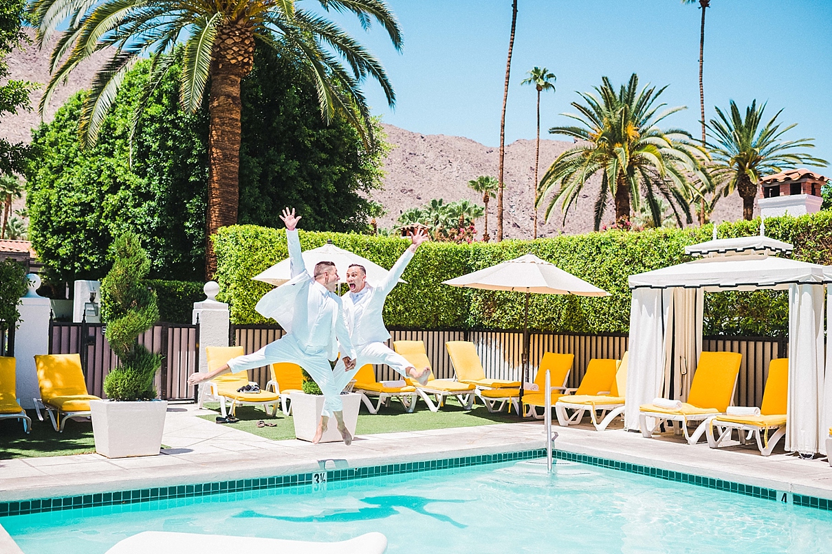 two grooms jumping into the pool, lou and chris's wedding