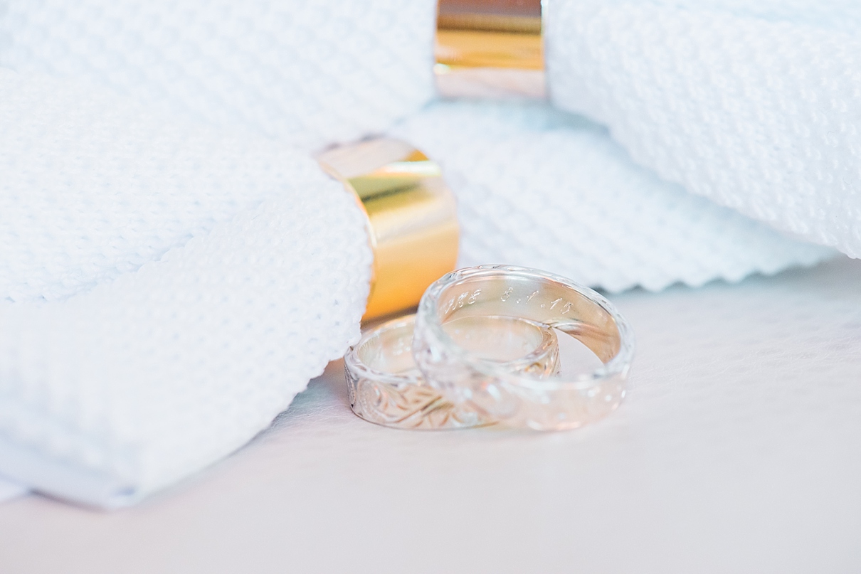 white michael costello bow ties with gold accents