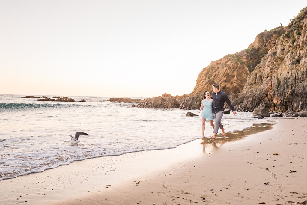 couple running on the beach