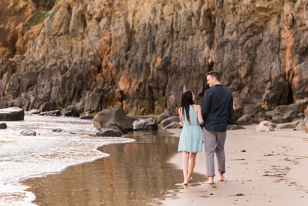 couple looking at each other at the beach
