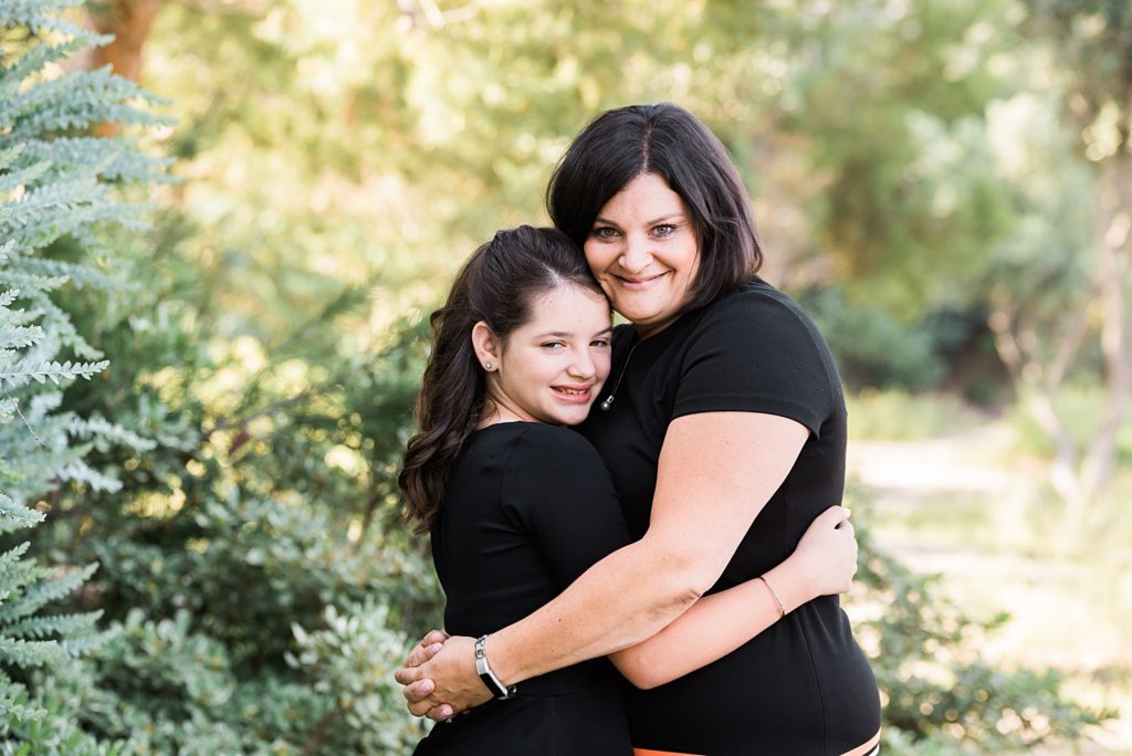 mother hugging her daughter