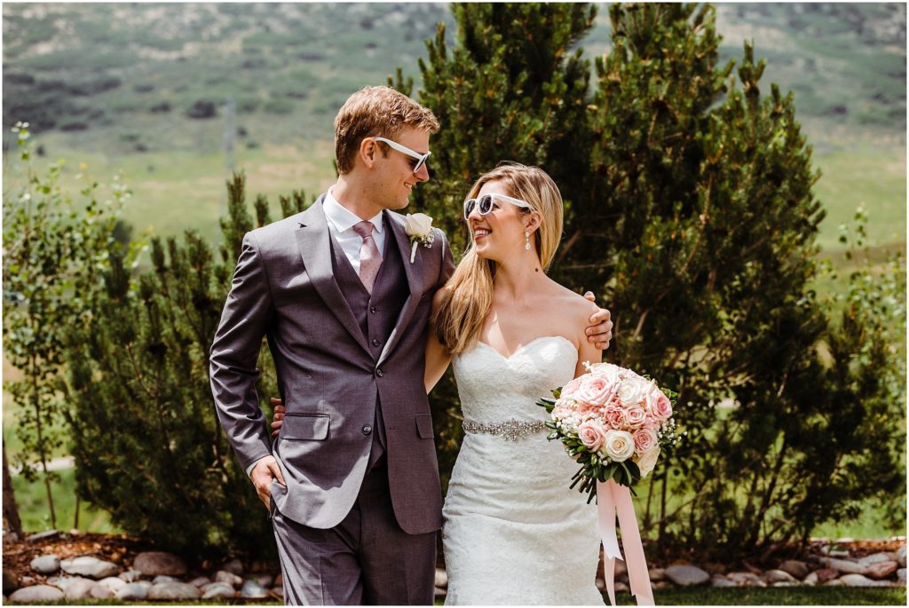 bride and groom wearing sunglasses