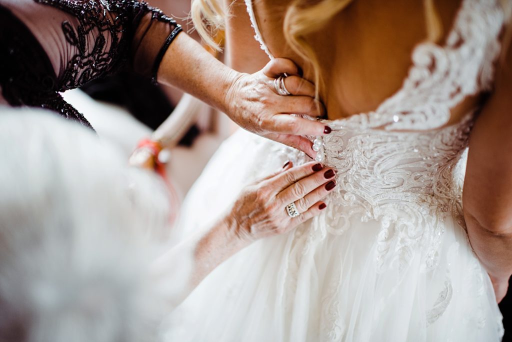 bride getting ready at manor house wedding in littleton colorado
