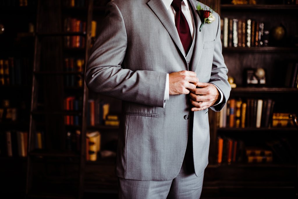 wedding photos inside the library at the manor house in littleton