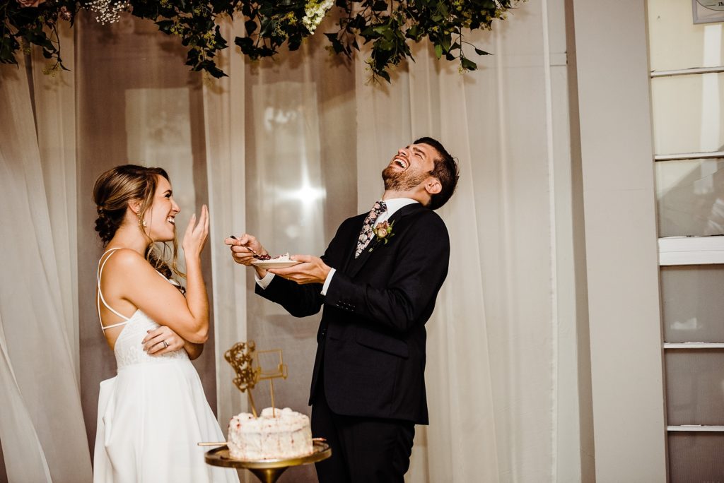 bride and groom cutting the cake