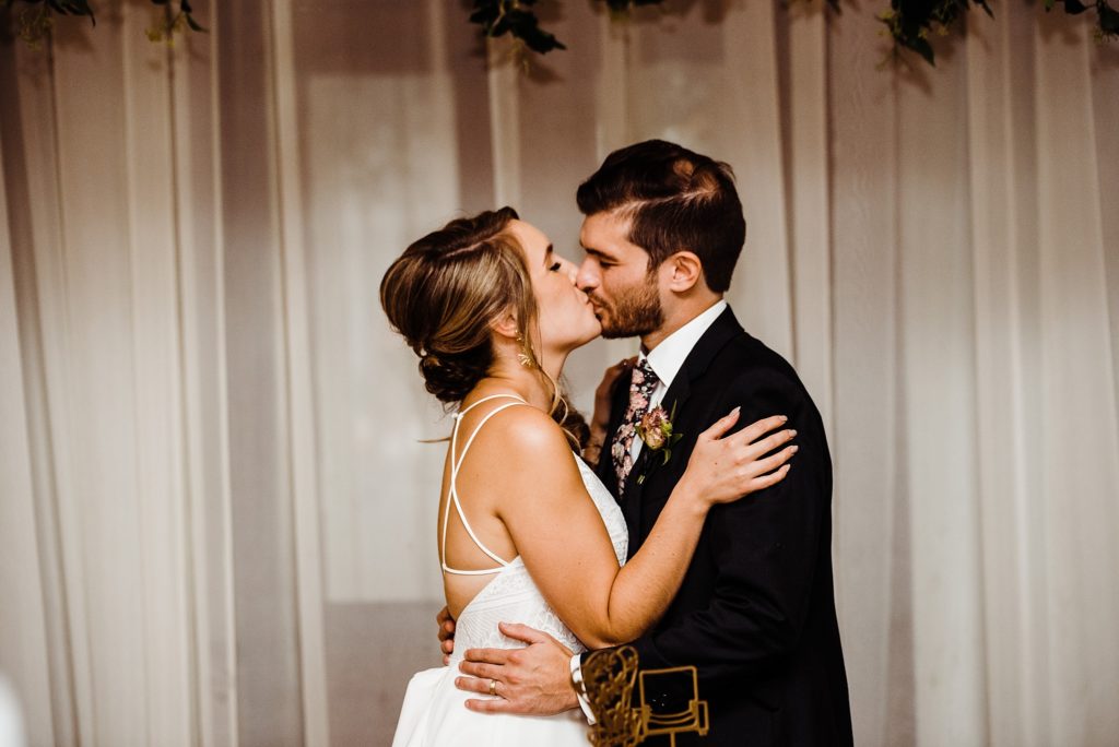 bride and groom cutting the cake
