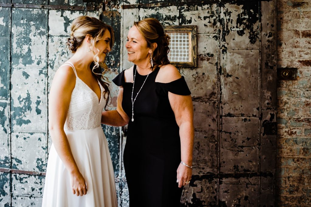 bride with mom before wedding