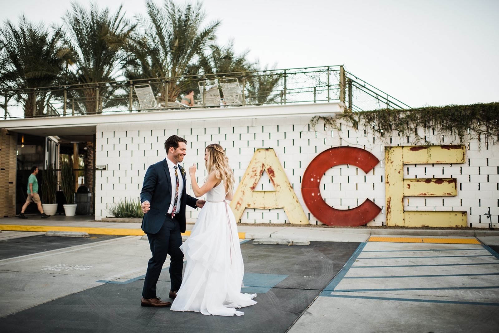 wedding photos at the front of the ace hotel in palm springs