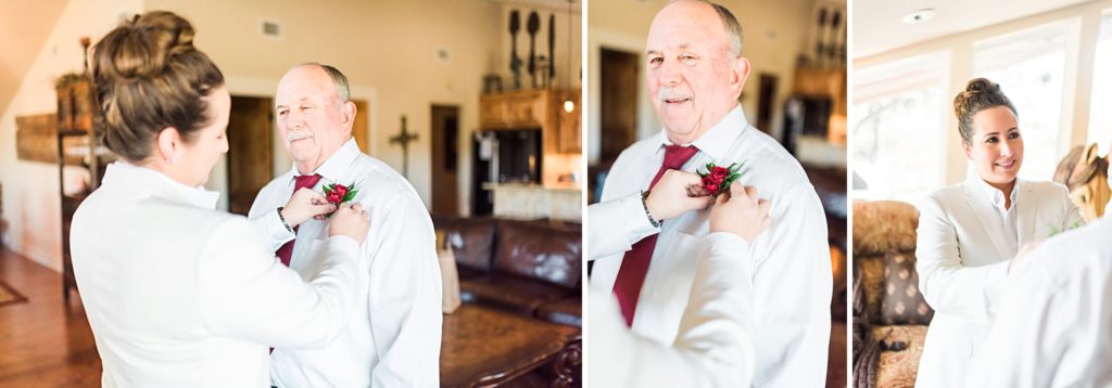 bride pinning on father's boutonniere 