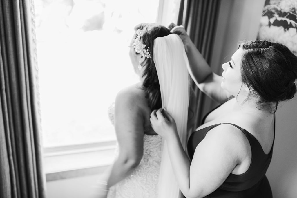 sister putting veil in