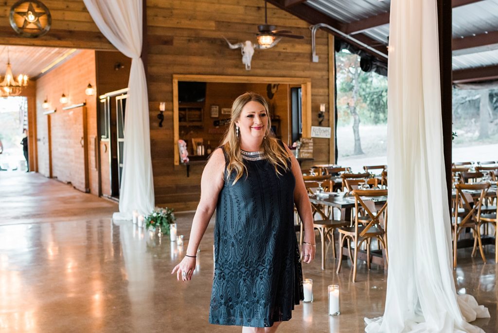 indoor wedding ceremony at rockin b ranch in pipe creek texas