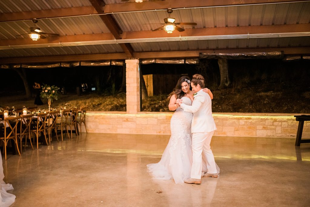 two brides dancing together 