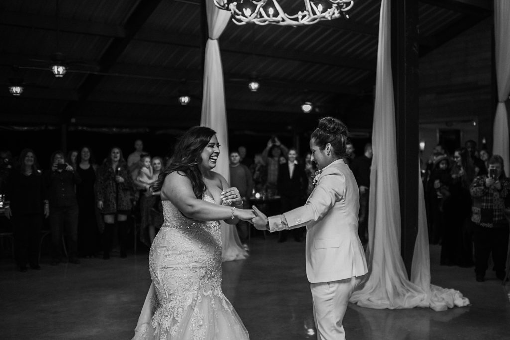 brides dancing together