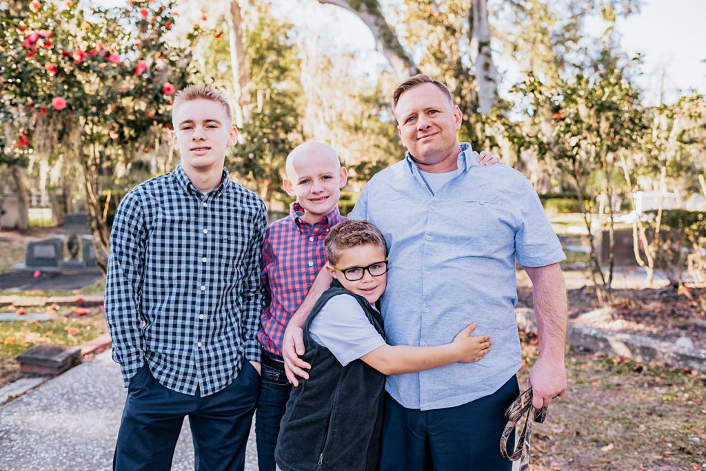 Father and sons standing together 
