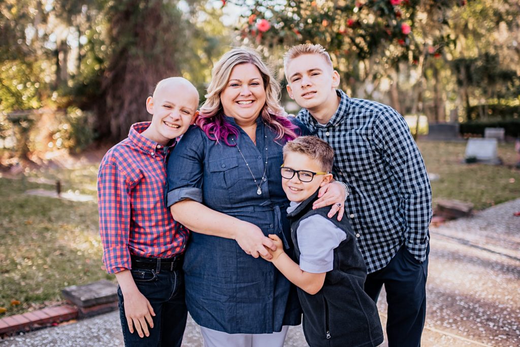 Mother and sons standing together