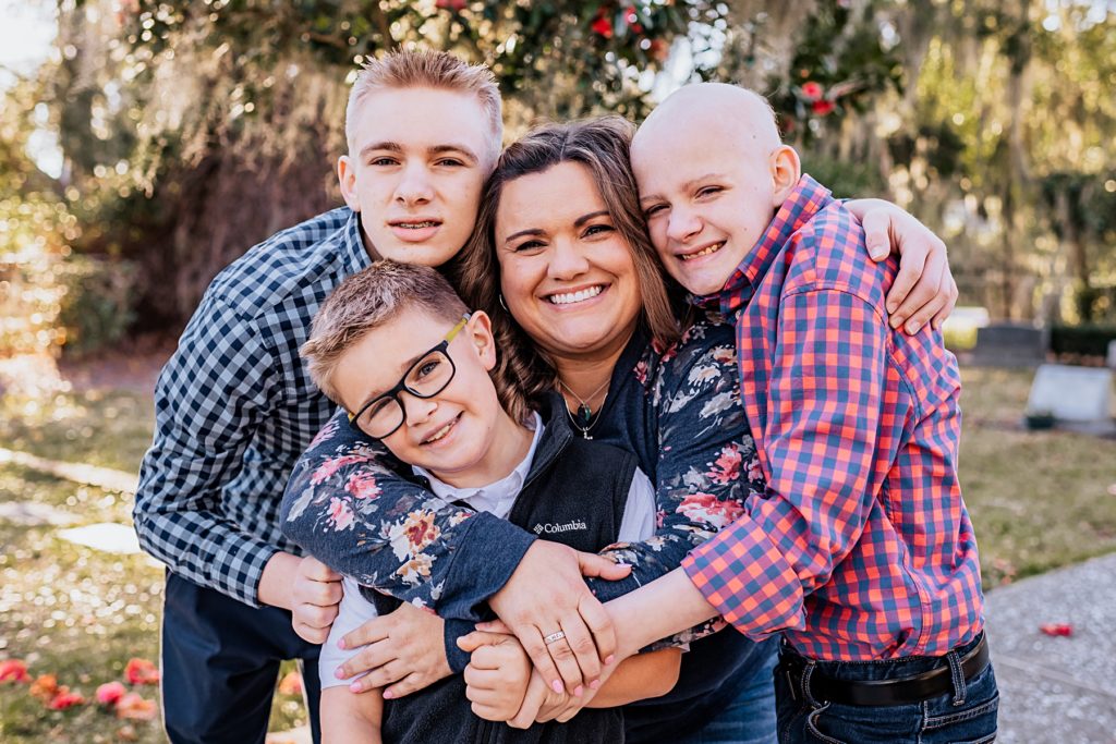 Aunt and her nephews loving on her