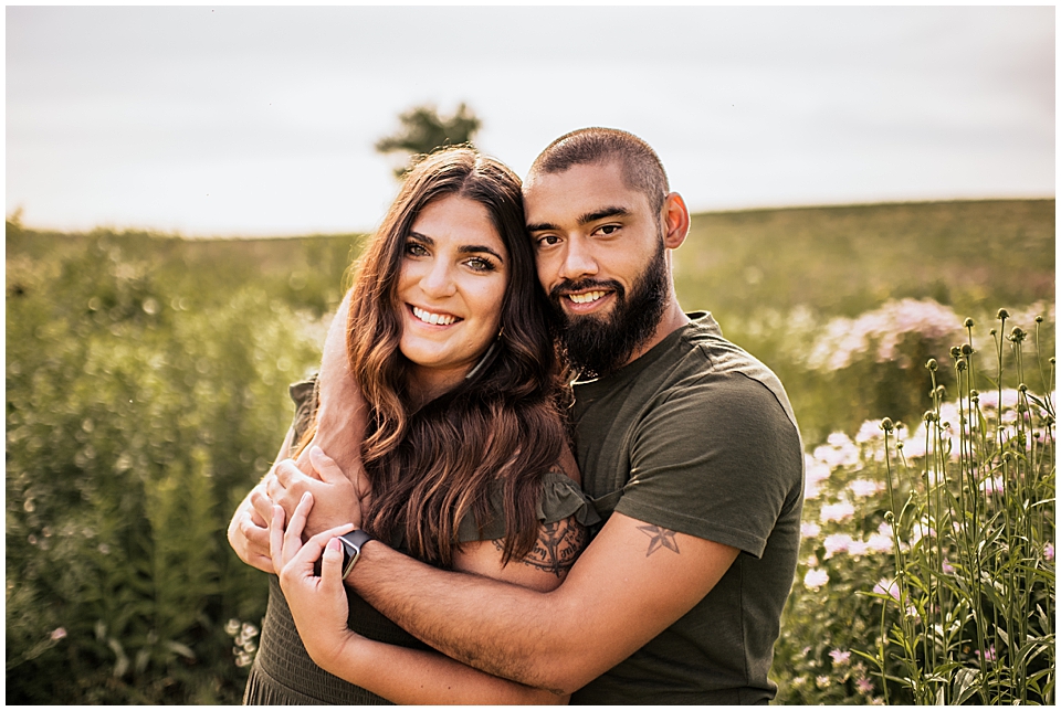couple in a field of wisconsin wildflowers at white river county park