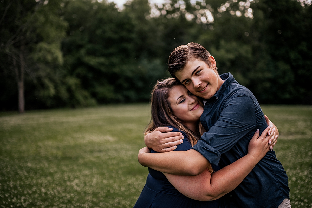 mom hugging oldest son 