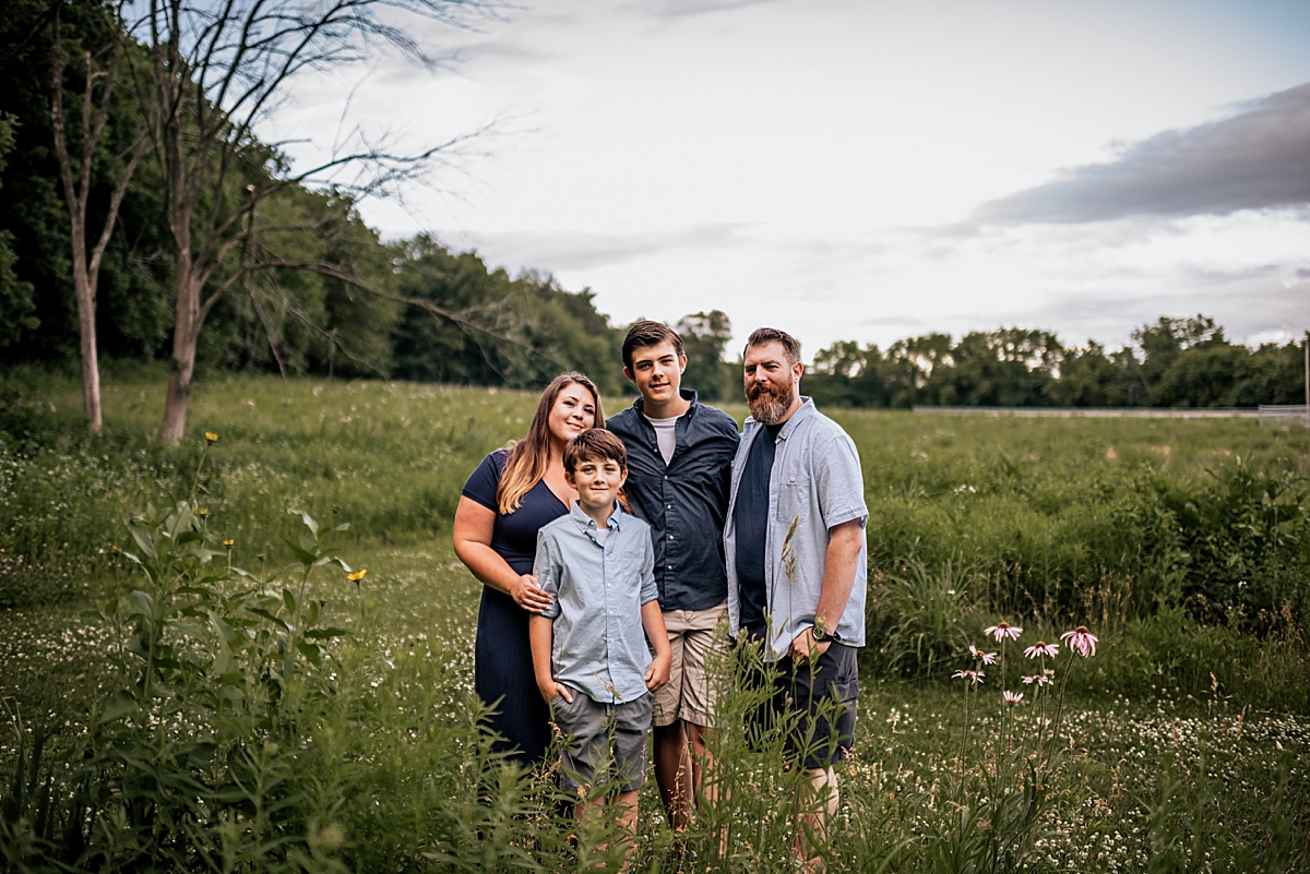 family in wild flowers in wisconsin