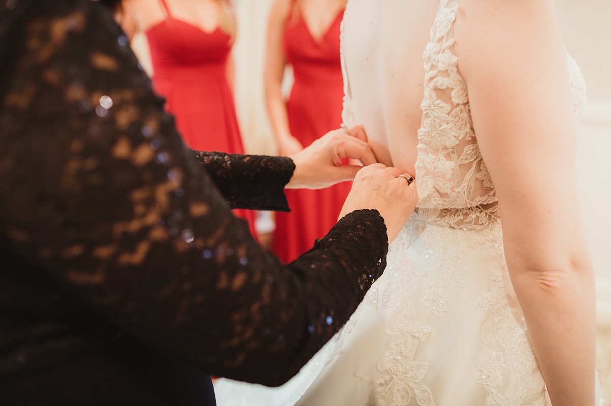 bride getting dressed for stella hotel wedding