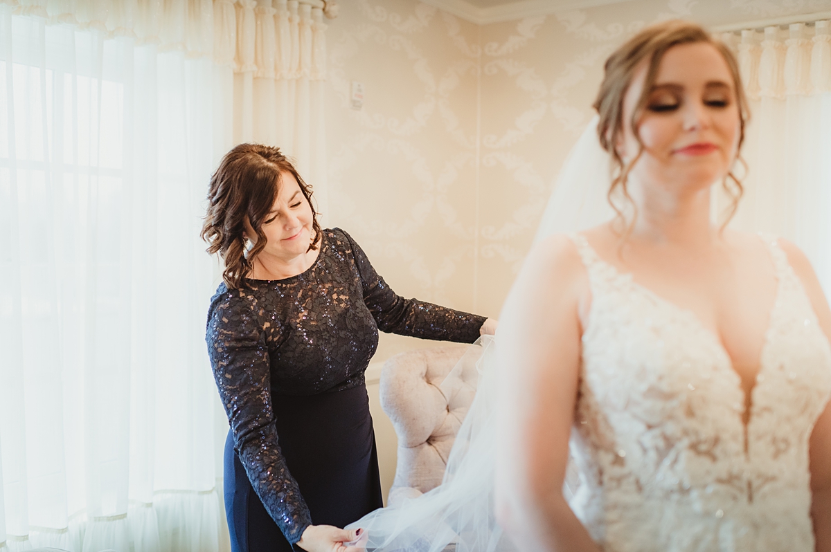 mother of the bride with the bride before her kenosha wedding at the stella hotel and ballroom
