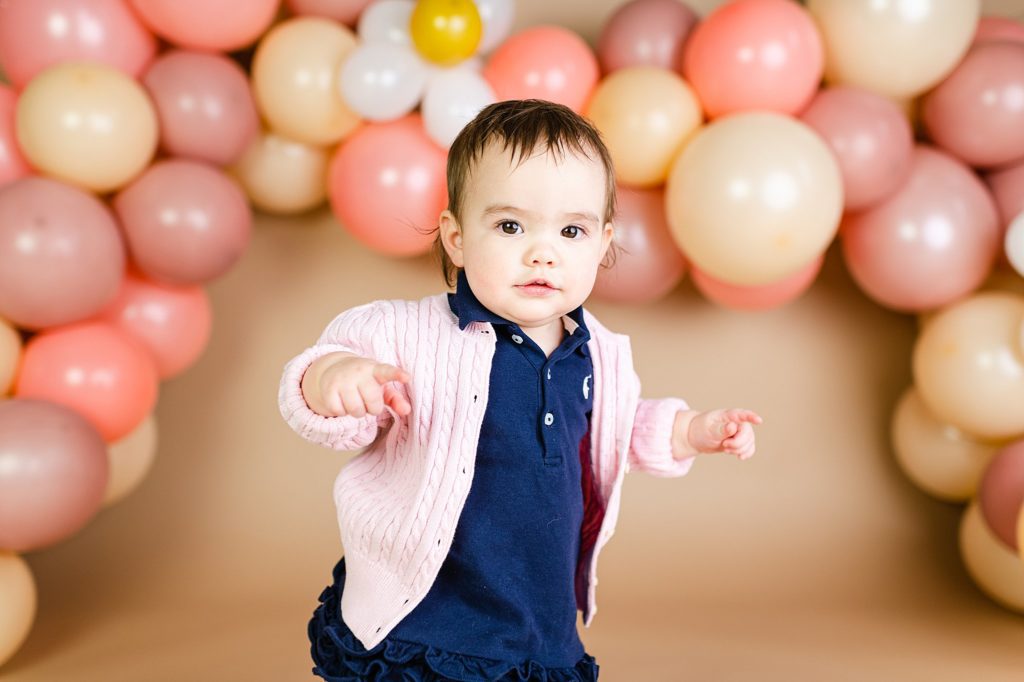 first birthday photos with multi colored balloons
