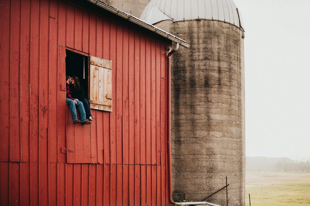 engagement photos with old red barn and silos