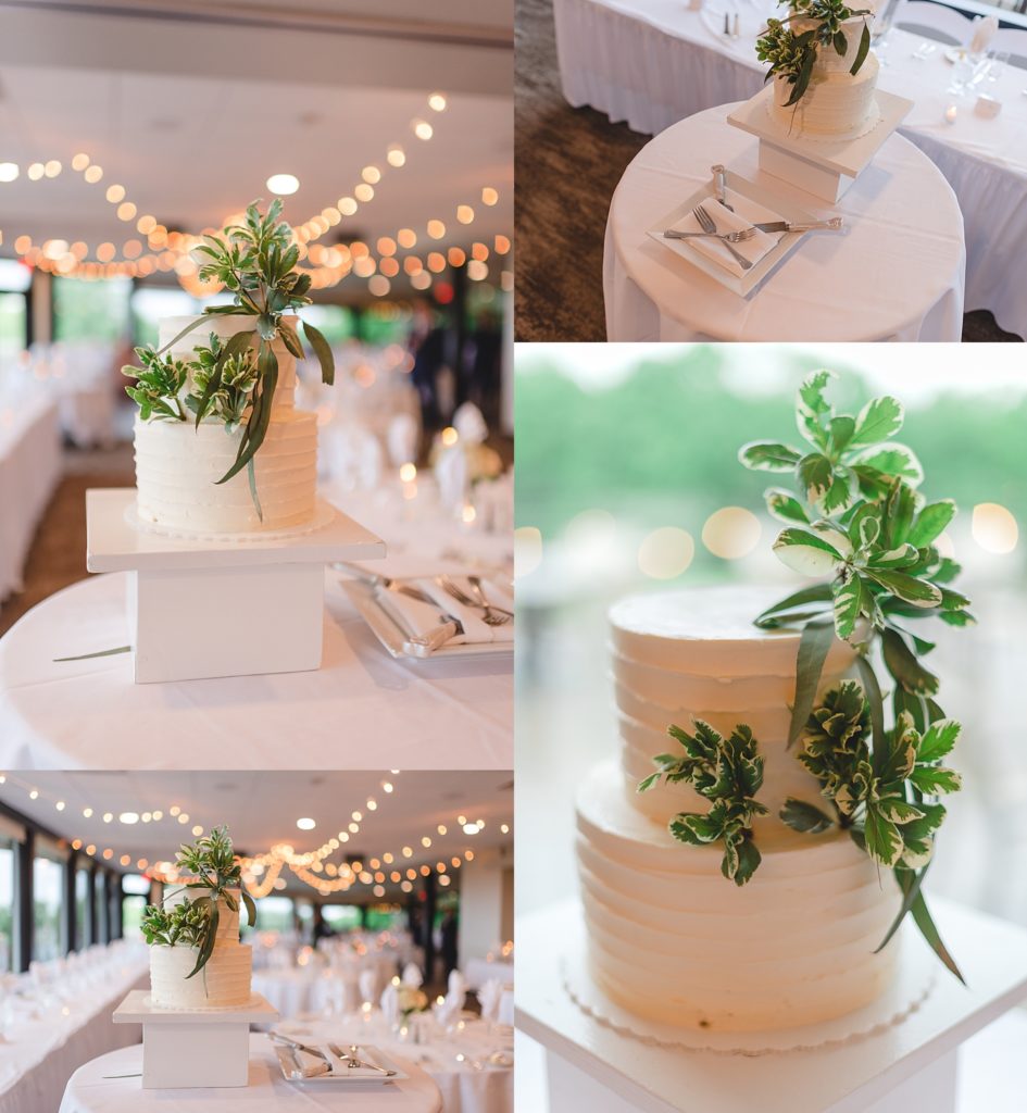 simple white wedding cake with greenery