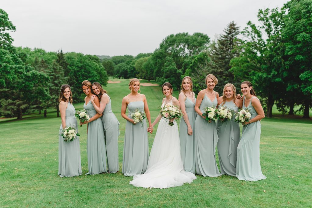 large bridal party wearing mint green dresses from davids bridal