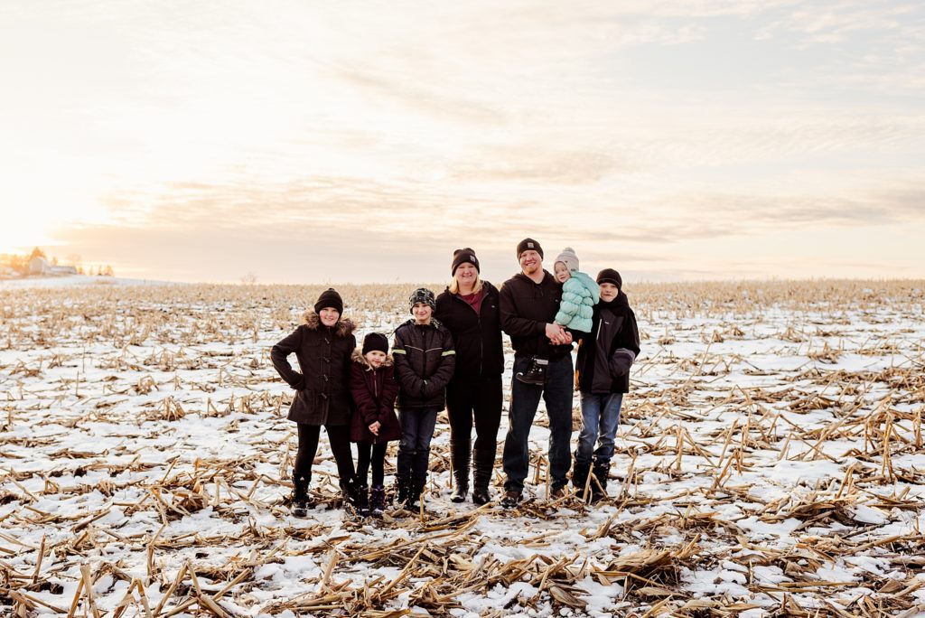 family session in wintery corn field in wisconsin
