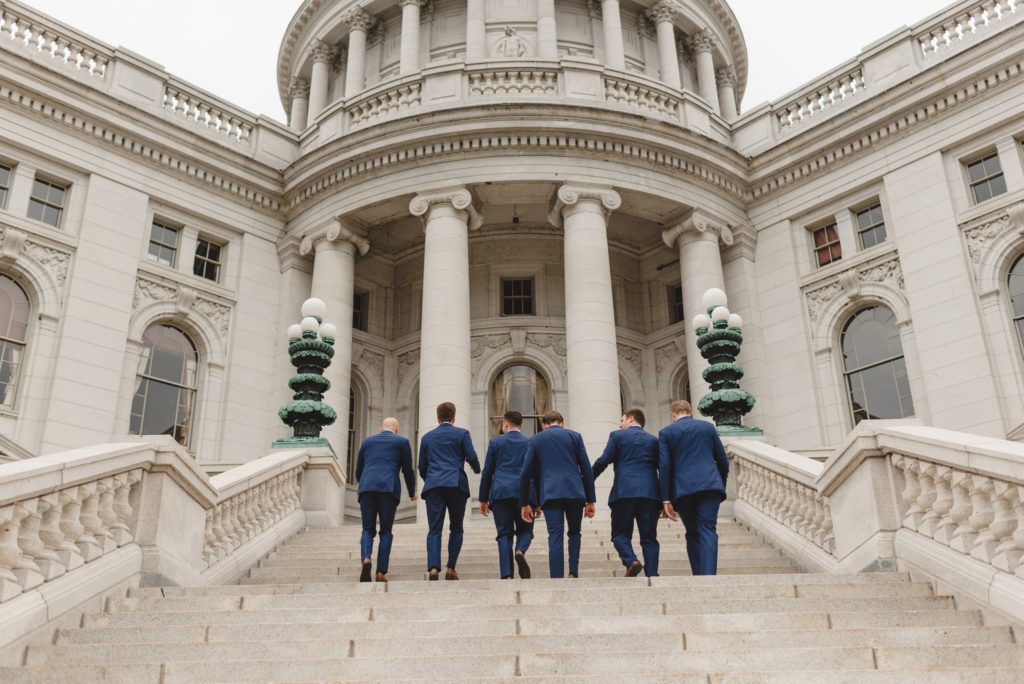 groom party photos on the steps of the wisconsin capitol building