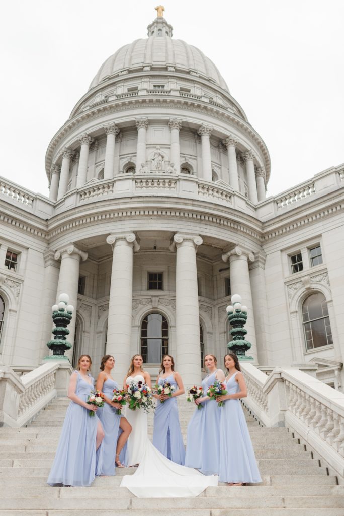 bridal party photos on the steps of the wisconsin capitol building