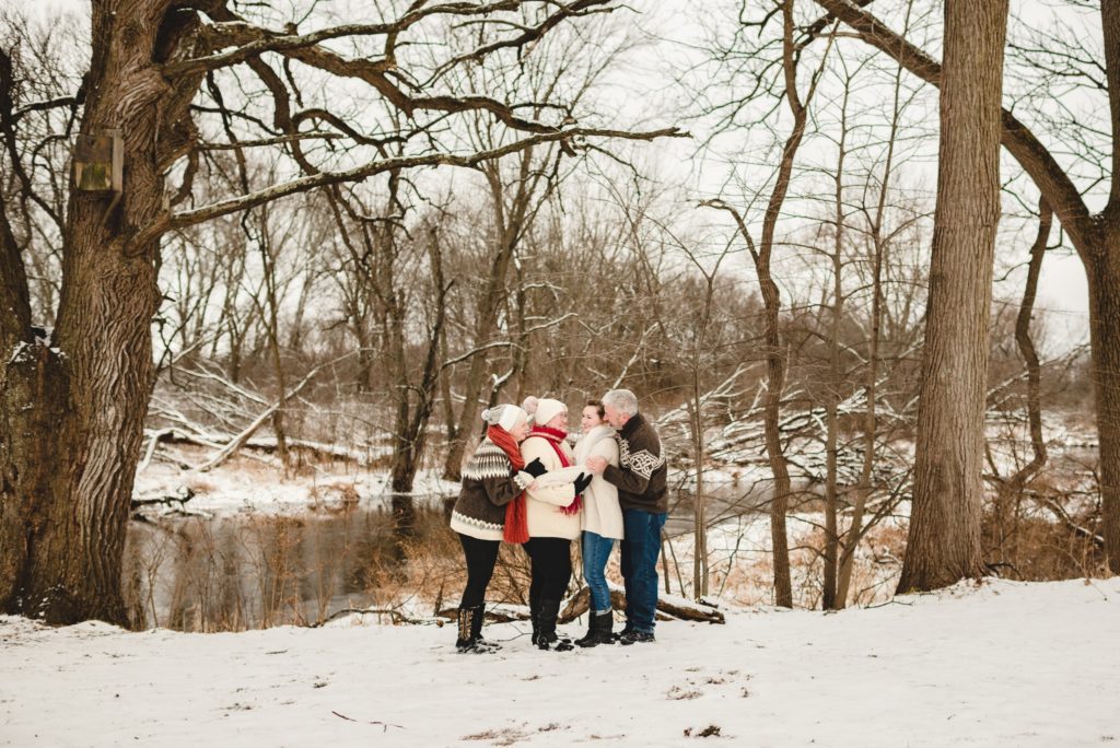 brown tan and orange neutral colors for wintery family session in the snow