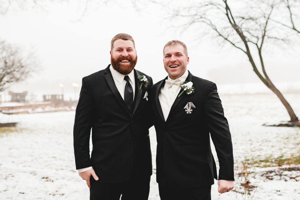groom and best man in formal tuxes