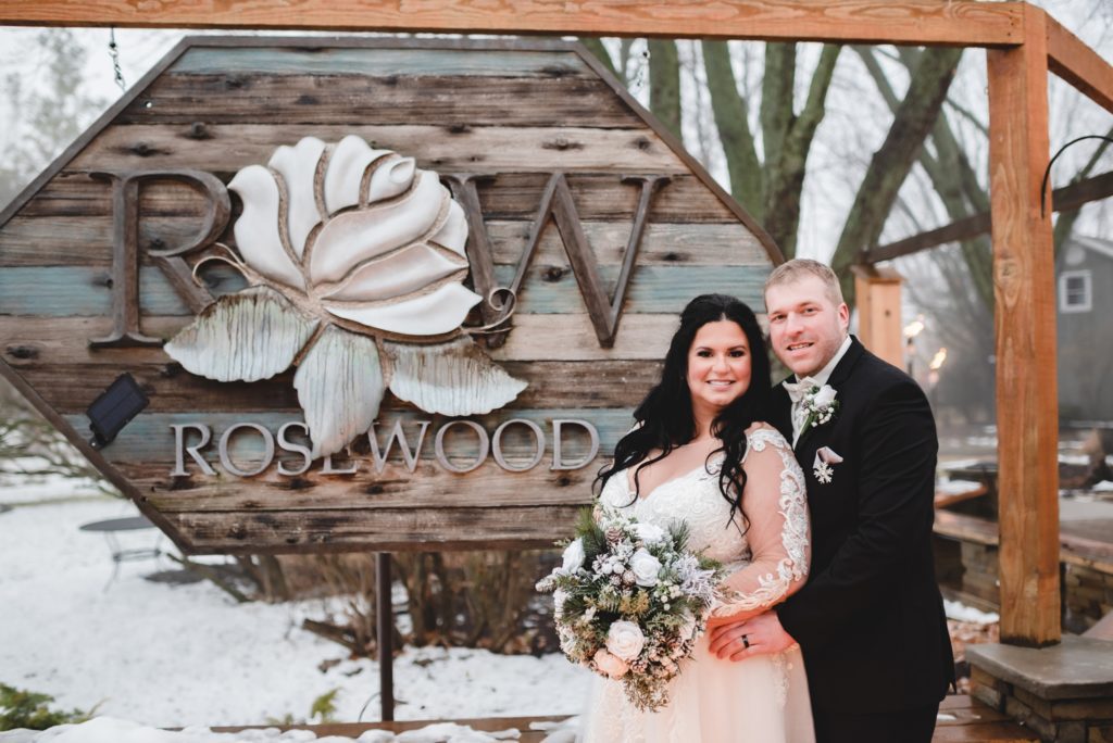 wedding photos in front of outdoor fire pit