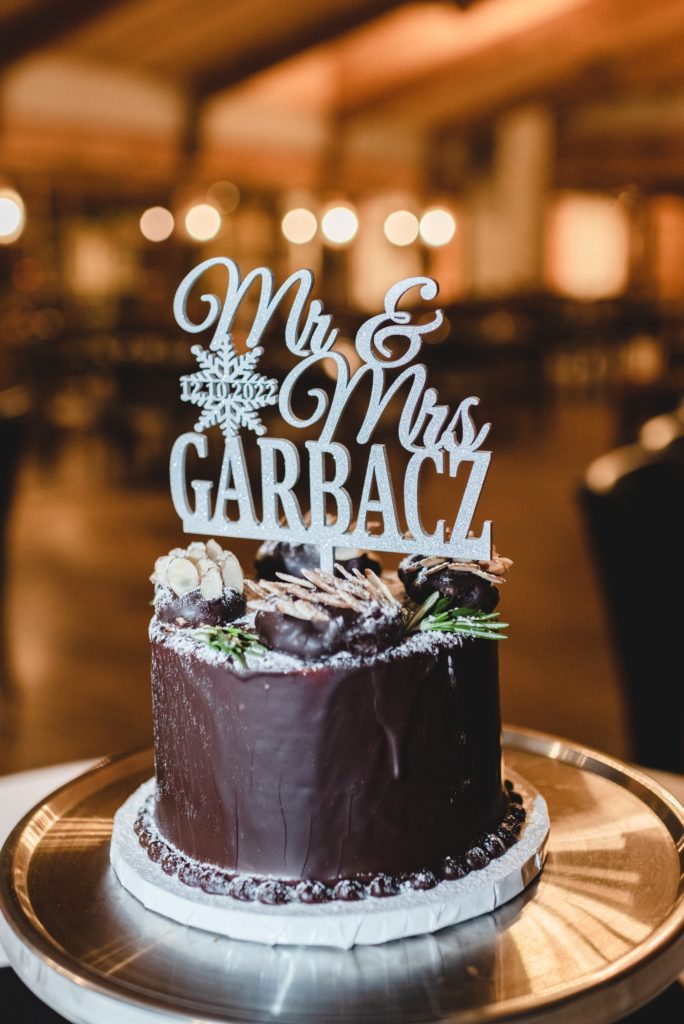 chocolate wedding cake with silver sparkle personalized cake topper