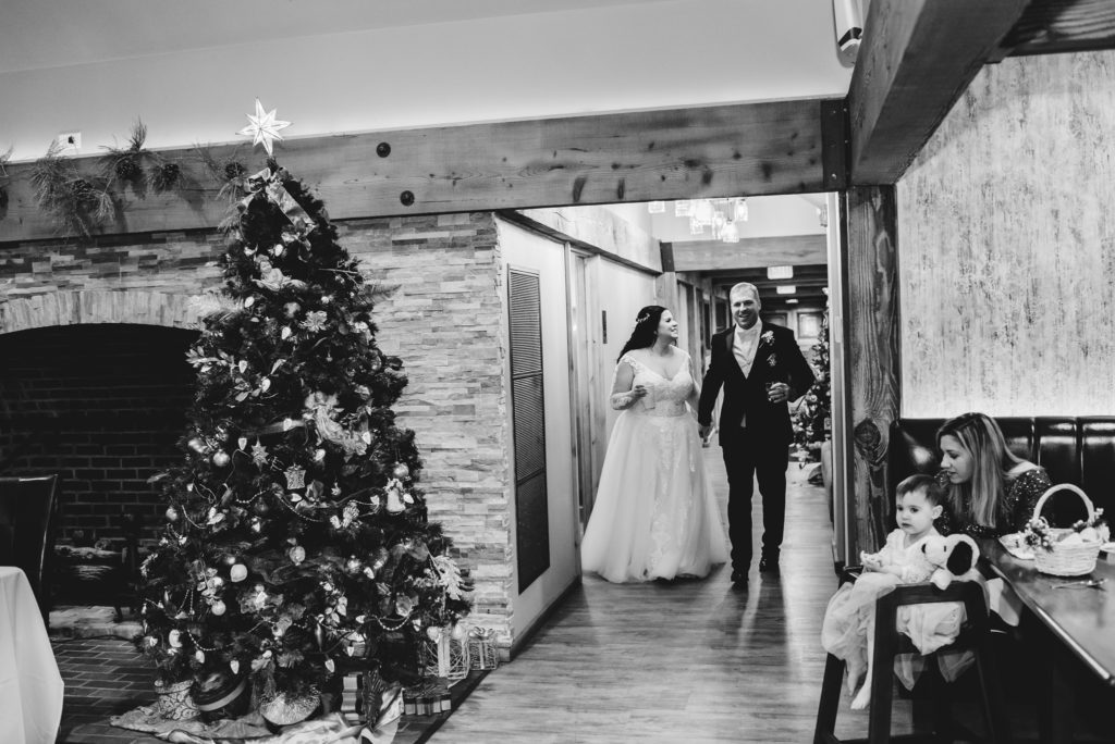 black and white image of bride and groom at grand march wedding reception
