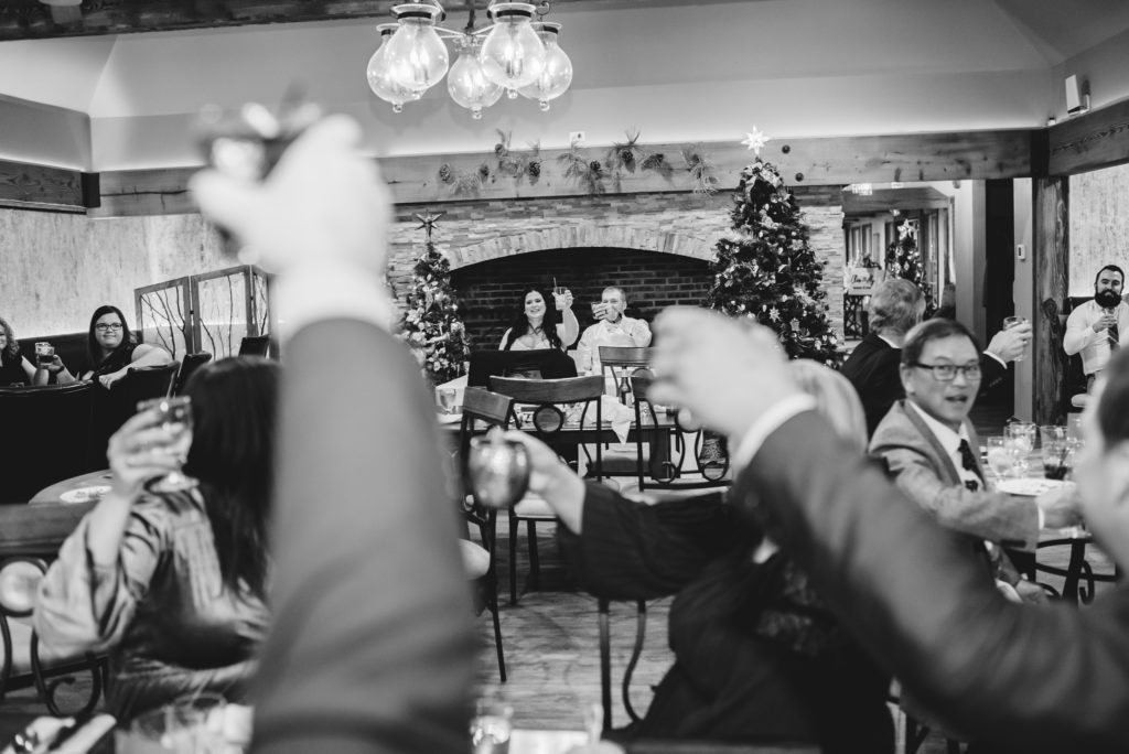 best man giving toast at indoor wedding reception