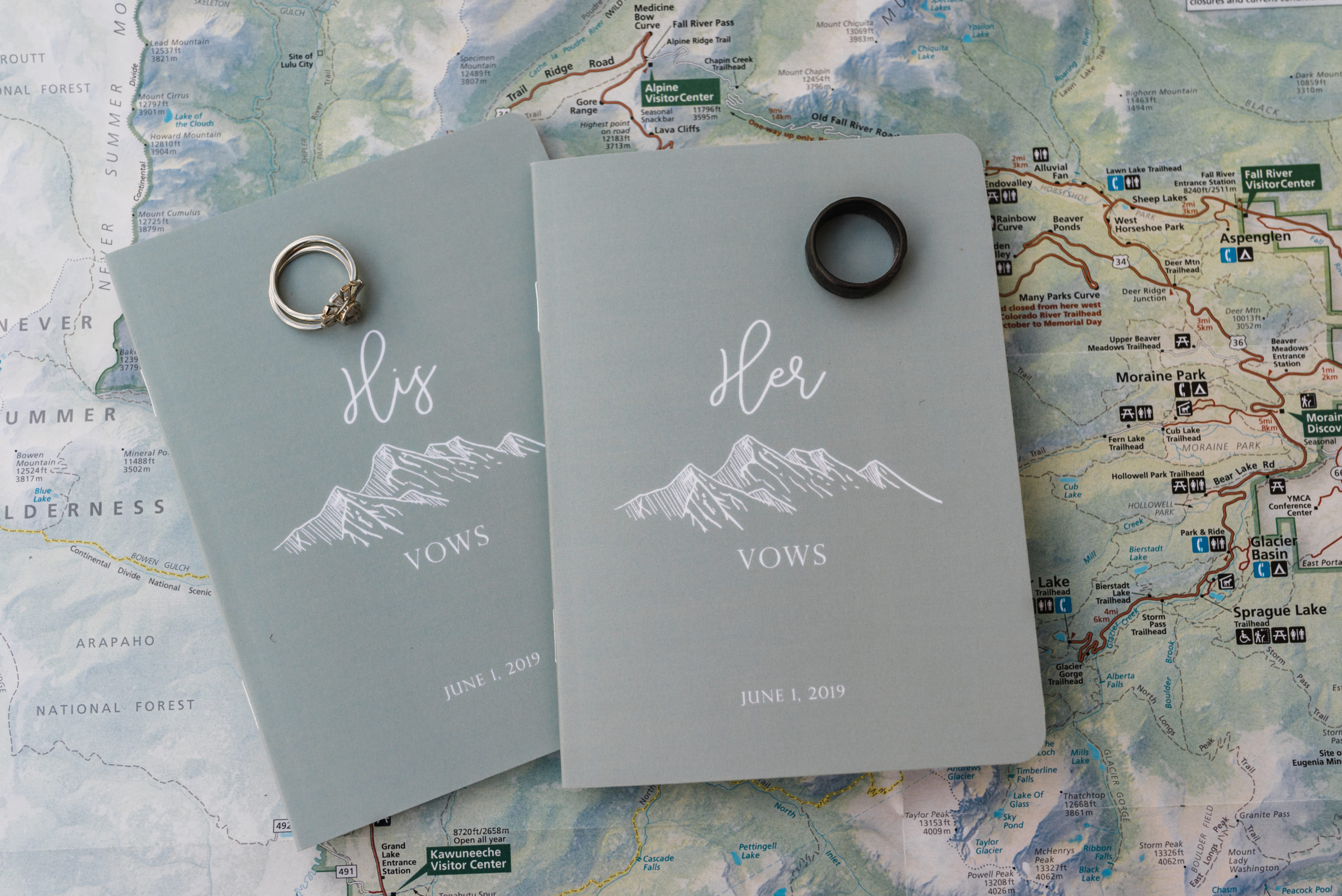 mountain inspired his and hers vows book with wedding rings
