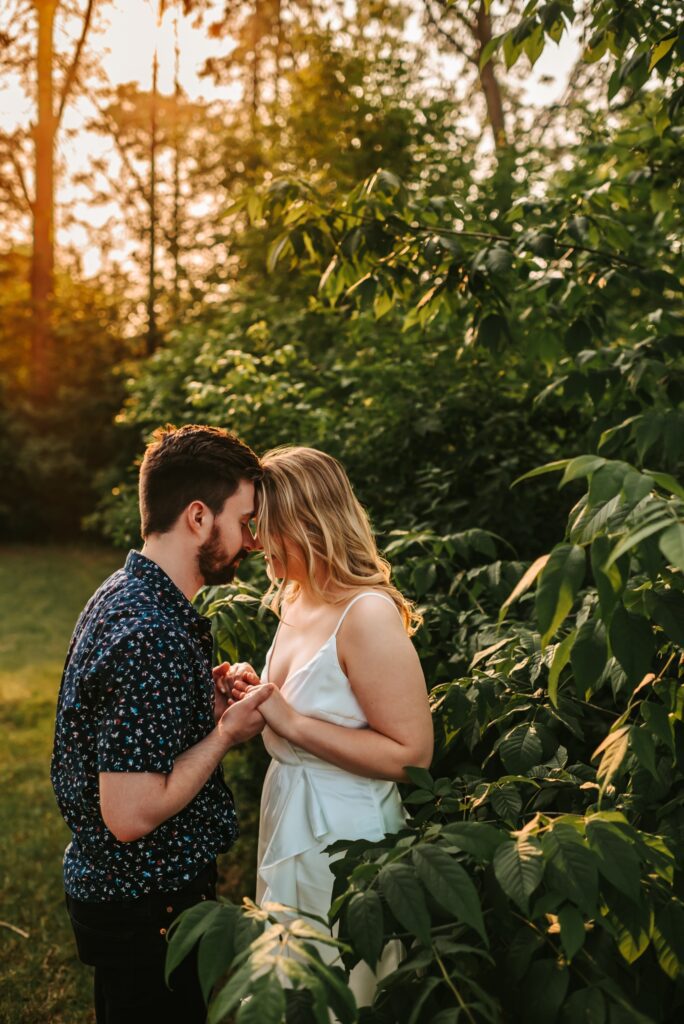engaged couple kissing romantically