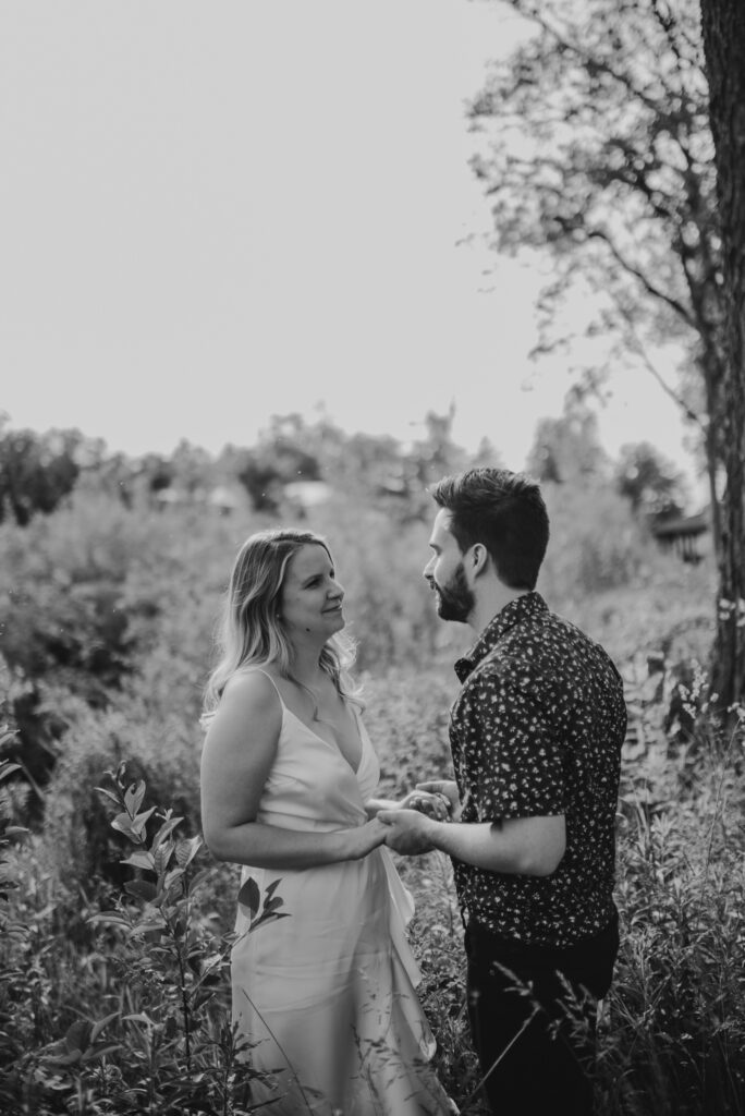 black and white enagement photos at a park in the summer