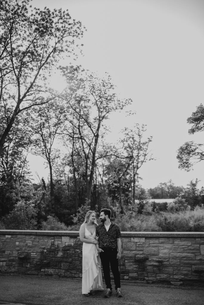 black and white enagement photos at a park in the summer