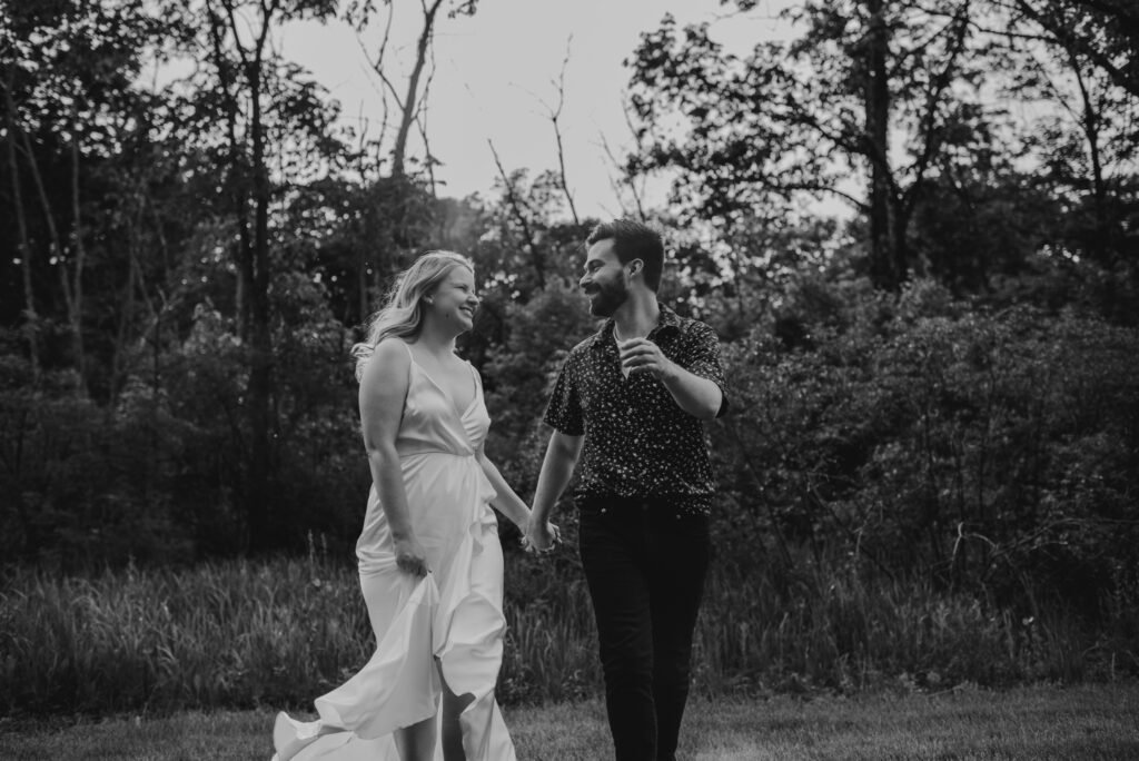 black and white enagement photos at a park in the summer