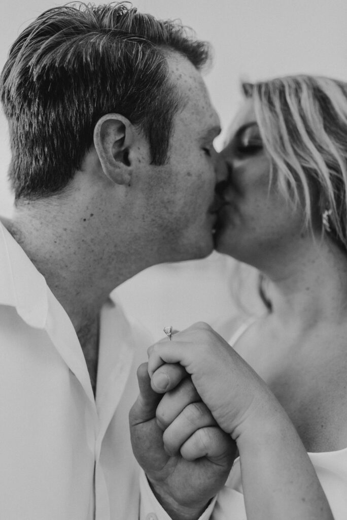 black and white romantic photo showing off engagement ring