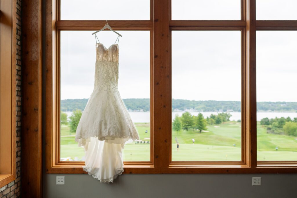 wedding dress hanging up in country club window