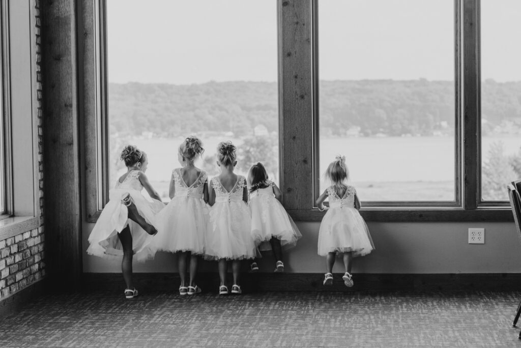 little flower girls looking out the window
