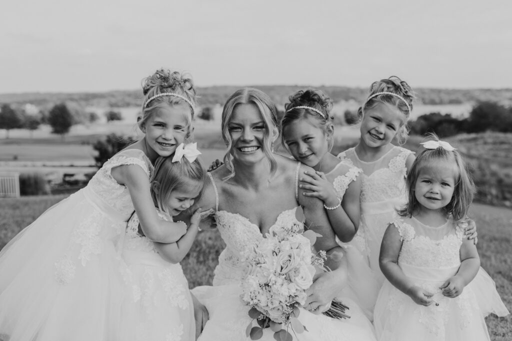 bride with flower girls at the geneva national
