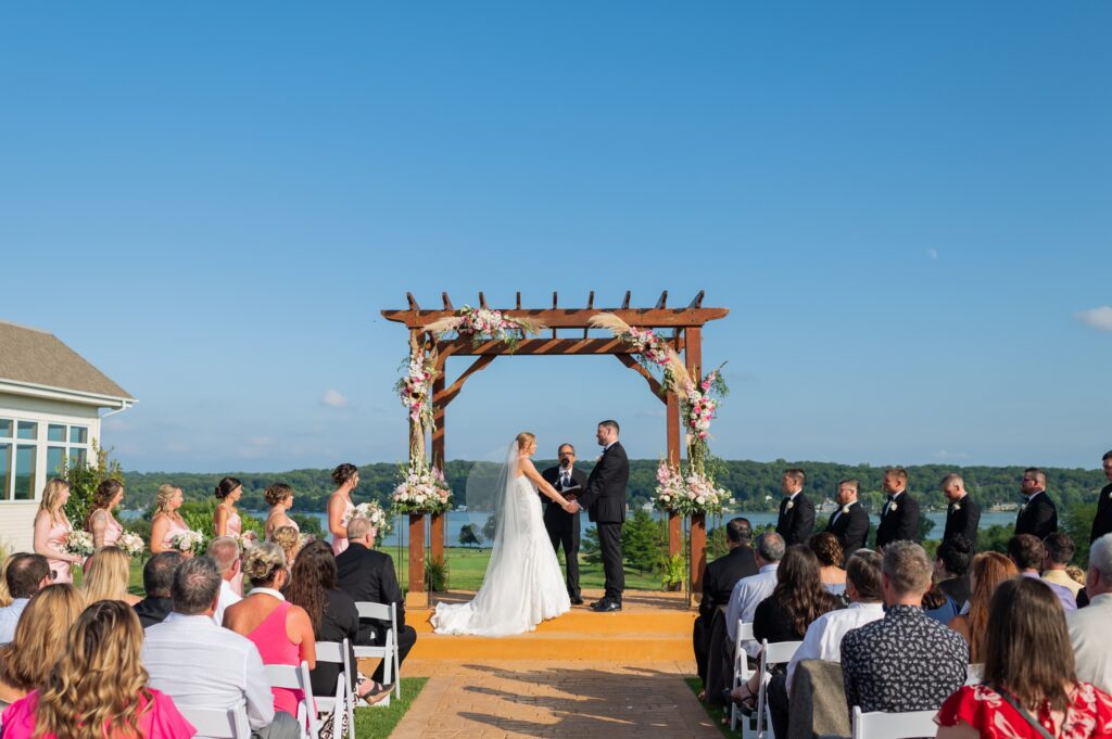 outdoor wedding ceremony in august at the geneva national in lake geneva