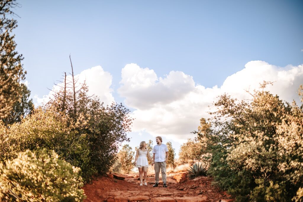 couple hiking together for arizona engagement session