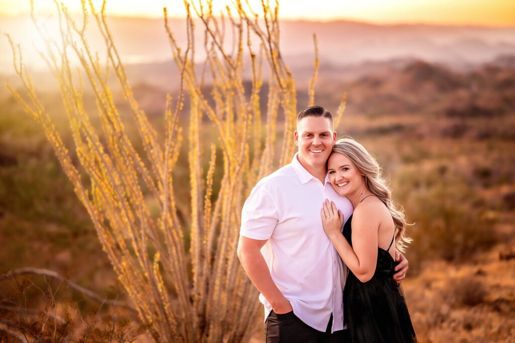 engagement photos in the desert with a mesquite bush